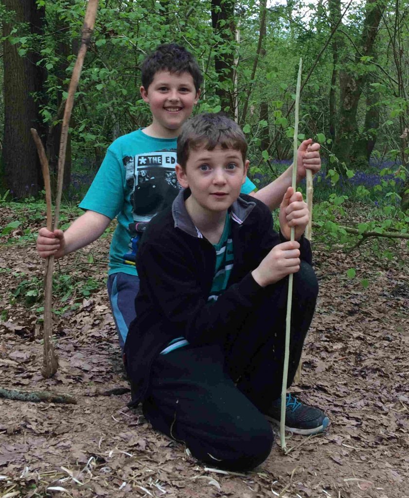 boys with whittled staffs